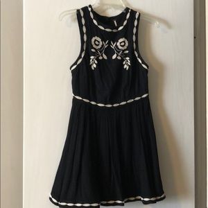 Black mini dress with cream embroidery